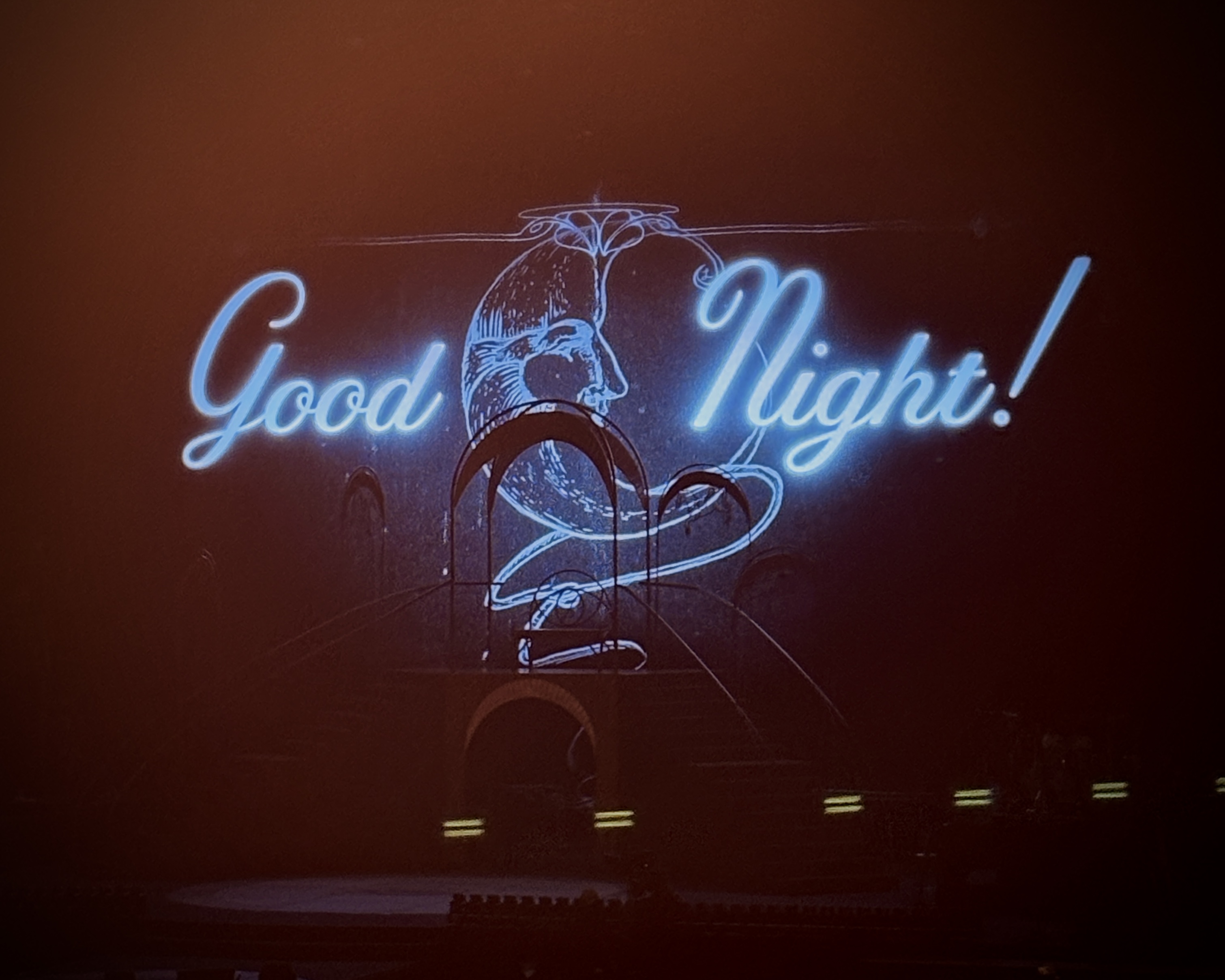 A "Good Night!" stage screen in glowing blue cursive at the end of the Laufey concert